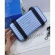 Replica Christian Dior e Rimowa Frizione personale in alluminio su cinturino blu Replica Christian Dior e Rimowa Frizione personale in alluminio su cinturino blu