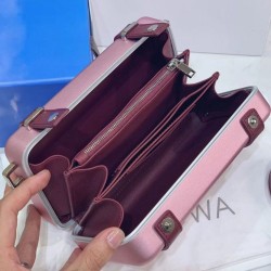 Christian Dior e Rimowa Clutch in alluminio con cinturino rosa